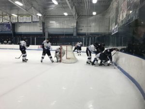 Redmen-Eagles action at the net.