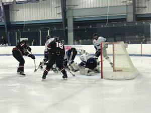 Ryan Baldwin enters the fray close to the Eagles' net.