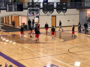 The Marquette Girls Varsity Basketball Team warming up on the Gladstone court.