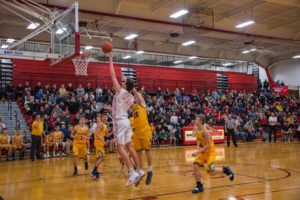This Marquette Redmen barely has to jump to put the ball in the net!
