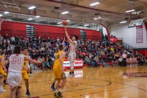 Another lay up for Marquette Redmen boys basketball player #3.