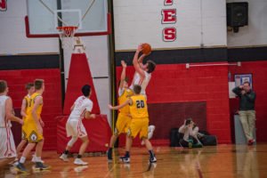 Playing defense to keep the ball out of the Miners hands.