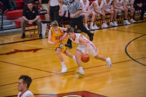 The Redmen move down the court into the Negaunee zone.
