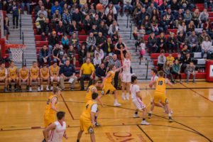 The Redmen take another shot at the basket.