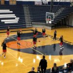 The Redettes warm up ahead of their game against the Brighton Bulldogs at the Petoskey Invitational.