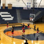 The Redettes warm up for their game against the Brighton Bulldogs.
