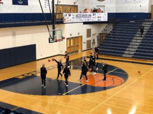 Brighton basketball warms up to take on our Redettes.