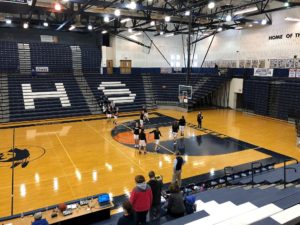 The Redettes warm up before their last game at the Petoskey Invitational.