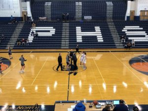 The Redettes and Northmen shake hands before the game.