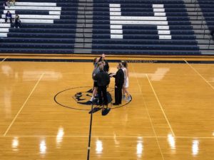 Opponents shake hands before the game.