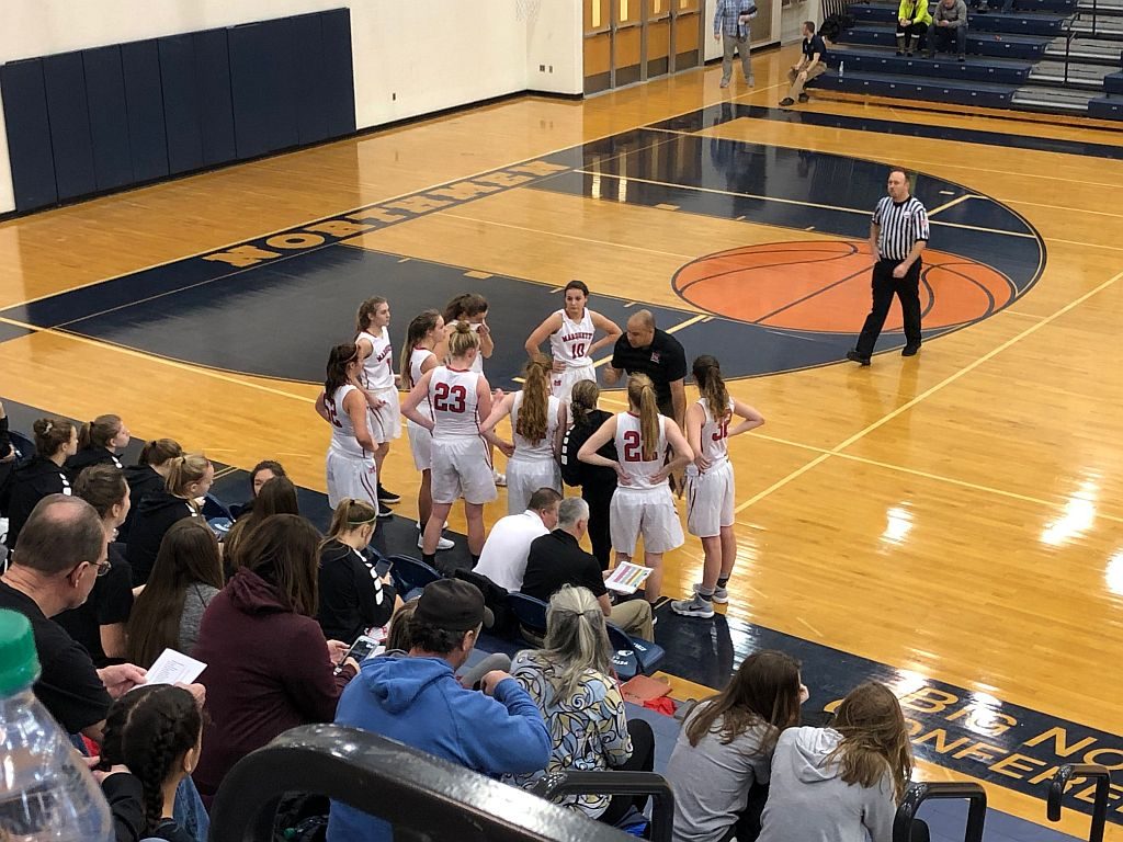 The Redettes strategize against the Petoskey Northmen.