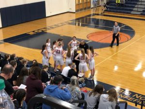 The Redettes strategize against the Petoskey Northmen.