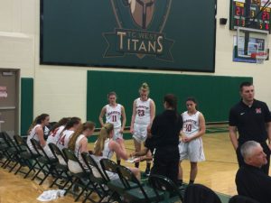 The Redettes strategizing against the Titans.