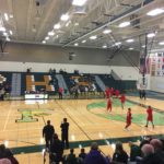 The Redmen warm up on the Green Bay Preble court.