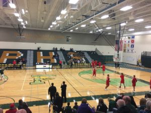 The Redmen warm up on the Green Bay Preble court.