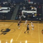 The Redmen drive up the court.