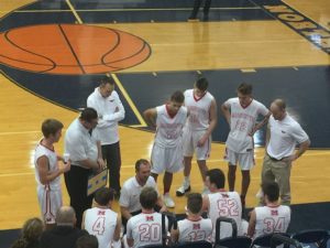 The Redmen strategize against the Petoskey Northmen.