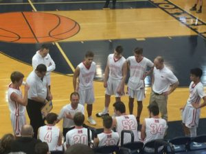 The Redmen huddled up as they took on the Petoskey Northmen.