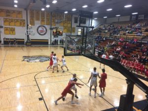The Redmen took on the Trojans at Traverse City.