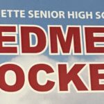Marquette Redmen Hockey sign.