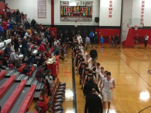 Opponents shake hands after the game.