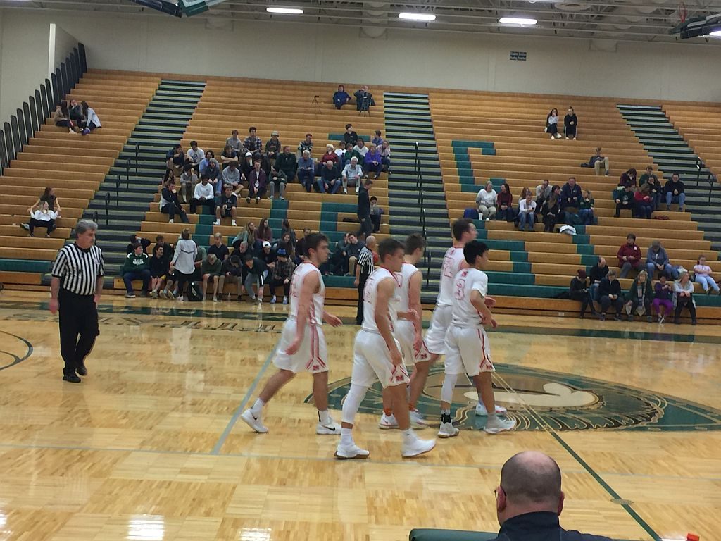The Redmen take the court.
