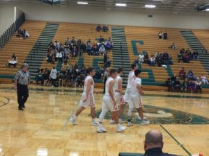 The Redmen take the court.