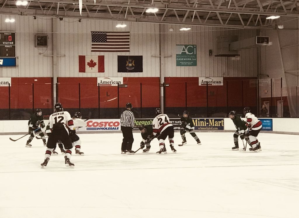 The puck drops for the game between your Marquette Redmen and the Alpena Wildcats at the Bay Reps Memorial Tournament