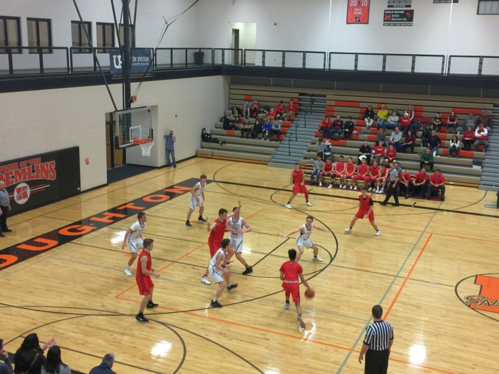 The Marquette Redmen drive toward the basket in Houghton on Tuesday night on 97.5 GTO-FM
