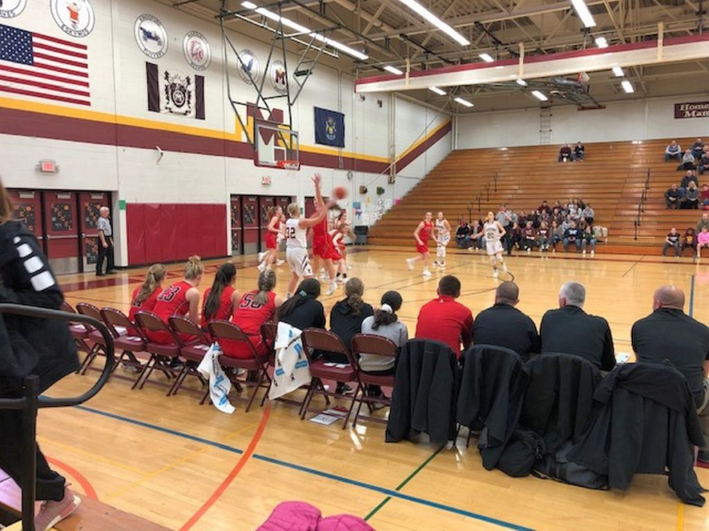The Marquette Redettes make a break for the basket down in Menominee on Friday, January 25th, 2019 on 97.5 GTO-FM