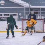 The yellow team in possession of the puck.