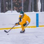 Moving down the ice to take a shot on the net.