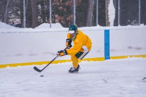 Moving down the ice to take a shot on the net.