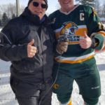 Todd Noordyk and one of the NMU Club Hockey Players.