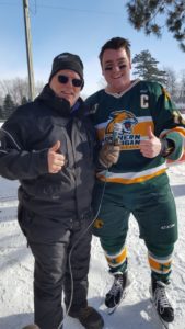 Todd Noordyk and one of the NMU Club Hockey Players.