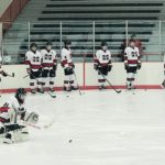 The Redmen warm up ahead of their bout against Gross Pointe South.