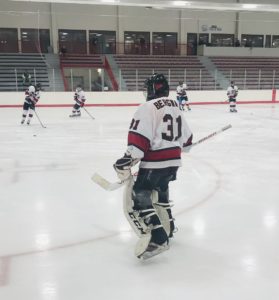 Tyler Bergwall gets ready to protect the Redmen goal.