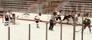 The Redmen scramble against the wall.