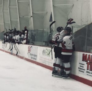 The Redmen celebrate a goal.