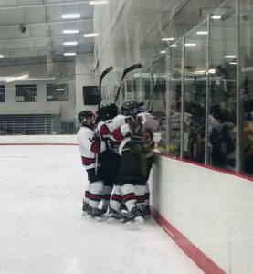 The Redmen celebrate another goal.