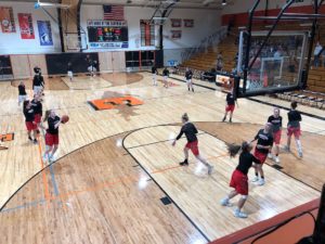 Redettes warm up for their bout against Escanaba.