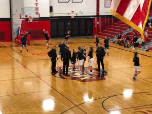 Opponents shake hands ahead of game.