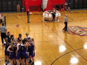 Opponents take to their respective huddles ahead of the game.