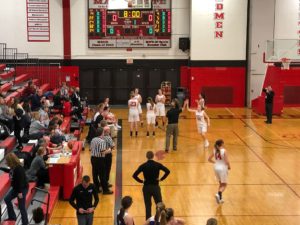 The Redettes warm up on their home court.
