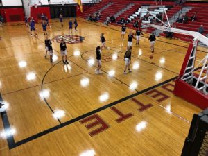 Opponents warm up ahead of the game.
