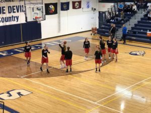 Redettes warm up for their Blue Devils match-up.