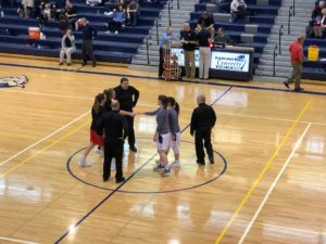 Opponents shake hands.