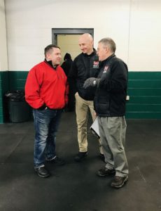 The coaches chat with Joe in between periods.