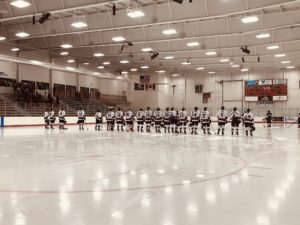 The Redmen get ready to face off against the Port Huron Northern Huskies.