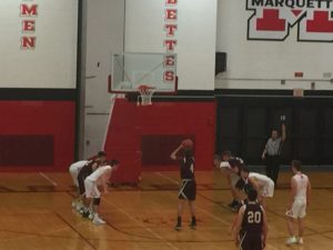 Menominee shoots a free throw in Friday night's game against Marquette.